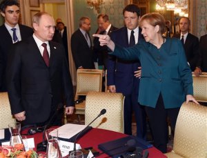 German Chancellor Angela Merkel, right, Russian President Vladimir Putin, left, and  Italian Prime Minister Matteo Renzi arrive for a meeting on the sidelines of the  ASEM summit of European and Asian leaders in Milan, northern Italy, Friday, Oct. 17, 2014. Russian President Vladimir Putin is looking to get relief from Western economic sanctions imposed since Russia's annexation of the Crimean Peninsula and its support for a pro-Russia insurgency in eastern Ukraine. To that end, he has scheduled a series of meetings on the sidelines of a two-day ASEM summit of European and Asian leaders. (AP Photo/Daniel Dal Zennaro, POOL)