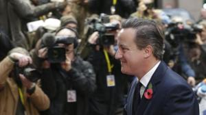 British Prime Minister David Cameron walks past journalists on the second day of an EU summit in Brussels, on Friday, Oct. 24, 2014. EU leaders gather for a two-day summit in which they discuss Ebola, climate change and the economy. 