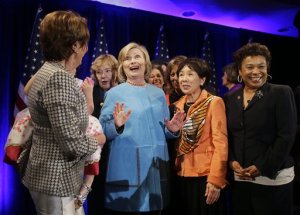 In this Oct. 20, 2014, photo, former Secretary of State Hillary Rodham Clinton, center, gathers with House Minority Leader Nancy Pelosi, left, Rep. Zoe Lofgren, second from left, Rep. Doris Matsui, second from right, and Rep. Barbara Lee, right, for a photo after speaking at a fundraiser for Democratic congressional candidates hosted by Pelosi at the Fairmont Hotel in San Francisco. Bill and Hillary Rodham Clinton are the validators-in-chief for Democrats struggling through a bleak campaign season in states where President Barack Obama is deeply unpopular. (AP Photo/Eric Risberg)