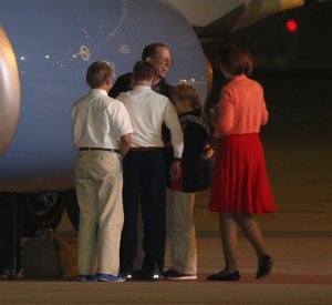 Jeffrey Fowle is greeted by family members on his arrival at Wright-Patterson Airforce Base, Wednesday morning, Oct. 22, 2014, in Dayton, Ohio. (AP Photo/David Kohl)