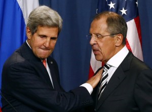 US Secretary of State John Kerry and Russian Foreign Minister Sergei Lavrov shake hands after a news conference in Geneva