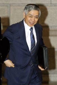 Bank of Japan Gov. Haruhiko Kuroda heads to a meeting at the headquarters of Bank of Japan in Tokyo Friday, Oct. 31, 2014. Japan's central bank expanded its asset purchases in a surprise move Friday to shore up sagging growth in the world's No. 3 economy. (AP Photo/Kyodo News)