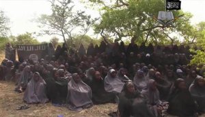 FILE - This Monday May 12, 2014 file image taken from video by Nigeria's Boko Haram terrorist network, shows the alleged missing girls abducted from the northeastern town of Chibok. Nigerias government and Islamic extremists from Boko Haram have agreed to an immediate cease-fire, officials said Friday Oct. 17, 2014. The fate of more than 200 missing schoolgirls abducted by the insurgents six months ago remains unclear. Defense Ministry spokesman Maj. Gen. Chris Olukolade said their release is still being negotiated. 