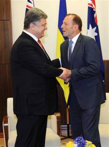 Ukrainian President Petro Poroshenko, left, and Australian Prime Minister Tony Abbott meet at the federal government office in Melbourne, Australia, Thursday, Dec. 11, 2014. Poroshenko will travel to Canberra, Sydney and Melbourne during his two-day visit. | Julian Smith, Pool AP Photo ›‹ "Please stop the fire. Please release the hostages. Please withdraw your troops from my territory. Please close the border," Poroshenko said during a press conference in Melbourne. "And I promise if you close the border, within one, two, three weeks, we have peace and stability in Ukraine. Very simple." Australia and Ukraine have formed close ties over the Flight 17 disaster, which killed everyone on board, including 38 Australian citizens and residents. Abbott and other Western leaders have accused Russia of providing military support for those Read more here: http://www.miamiherald.com/news/nation-world/article4416216.html#storylink=cpy