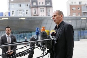 Greek Finance Minister Yanis Varoufakis speaks to journalists after a meeting with European Central Bank President Mario Draghi in Frankfurt, Germany