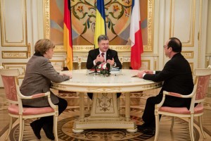  A handout photo taken and released on February 5, 2015 by the Ukrainian Presidency office shows Ukrainian President Petro Poroshenko (C), German Chancellor Angela Merkel (L) and French President Francois Hollande during their talks in Kiev on February 5, 2015. Angela Merkel and Francois Hollande announced on Thursday that they are presenting a new peace plan for the Ukraine conflict.