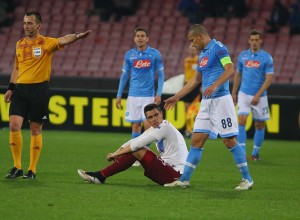  Trabzonspor's Oscar Cardozo (C) and Napoli's Gokhan Inler (88) at the end of the UEFA Europa League Round of 32 second leg football match between Napoli and Trabzonspor at the San Paolo Stadium in Naples, Italy on February 26, 2015.