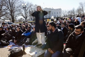 Call to prayer as a group of Muslim people and their supporters prepare to say the Friday prayers outside the White House in Washington, Friday