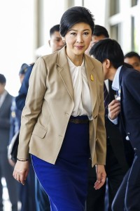 Thailand's Prime Minister Yingluck arrives at the Royal Thai Air Force headquarters before a cabinet meeting in Bangkok