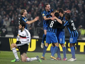  Players of Club Brugge celebrate Tom De Sutter's score during the UEFA Europa League round of 16 football match between Club Brugge and Besiktas at Ataturk Olympic stadium in Istanbul on March 19, 2015.