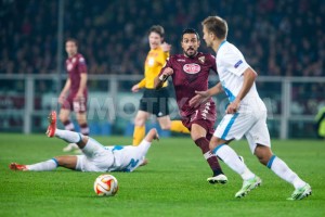 Torino's forward Fabio Quagliarella (27) competes for the ball with Domenico Criscito (4) of FC Zenit during the UEFA Europa League Round of 16, second leg match between Torino FC and FC Zenit in Turin