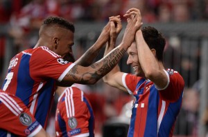 Jerome Boateng (L) and Robert Lewandowski of Bayern Munich celebrate after a goal during the UEFA Champions League Quarter Final Second Leg soccer match between Bayern Munich and FC Porto at the Allianz Arena on April 21, 2015 in Munich, Germany.