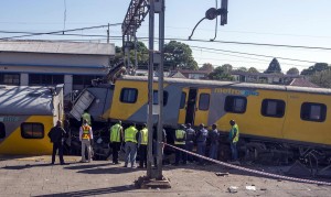  APRIL 28: Security forces and rescuers work at the scene after two trains collided at Denver train station in Johannesburg, South Africa on April 28, 2015. The train collision left dead and many woundeds, reported.