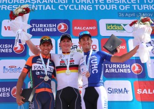  Winner German cyclist Andre Greipel (C) of Lotto Soudal, second Italian cyclist Daniele Colli (R) of Nippo-Vini Fantini team and Italian cyclist Danielle Ratto (L) of UnitedHealthcare Pro Cyling pose for photo after the fourth stage (Fethiye-Marmaris) of the 51st Presidential Cycling Tour of Turkey in Mugla on April 29, 2015. One hundred and sixty-five participants from over 21 countries will compete in the tour. Competition will be held on April 26 - May 3, 2015 in 8 stages starting from Alanya, proceeding along the Mediterranean and Aegean coasts and will be finished in Istanbul.