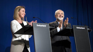 European Union High Representative for Foreign Affairs and Security Policy Federica Mogherini (L) and Iranian Foreign Minister Javad Zarifat clap after making statements following nuclear talks at the Swiss Federal Institute of Technology in Lausanne (Ecole Polytechnique Federale De Lausanne) April 2, 2015.