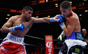 Amir Khan punches Chris Algieri during their Welterweight bout at Barclays Center of Brooklyn on May 29, 2015 in New York City.  