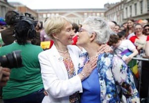 Irish Senator Katherine Zappone, right, and partner Ann Louise Gilligan celebrate as the first results in the Irish referendum start to filter through at Dublin Castle, Ireland, Saturday, May 23, 2015.