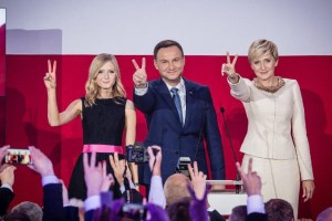 Andrzej Duda (C), presidential candidate of PiS celebrates with his wife Agata (R) and daughter Kinga after the announcement of the exit poll results of the second round of the presidential election in Warsaw, on May 24, 2015 