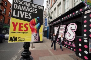 Pedestrians walk past a mural in favour of same-sex marriage in Dublin on May 21, 2015. 