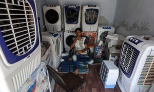 A vendor waits for customers to buy air-conditioners and ventilators in Ahmedabad.
