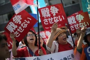 Hundreds of people stage a rally outside the Japanese Prime Minister’s Office in Tokyo, Thursday, May 14, 2015, opposing a set of controversial bills intended to expand Japan’s defense role at home and internationally.