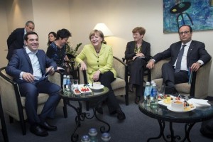 Picture released by German government on May 21, 2015 shows German Chancellor Angela Merkel (C), Greek Prime Minister Alexia Tsipras (L) and French President Francois Hollande (R) before a meeting on the sidelines of the EU summit in Riga 