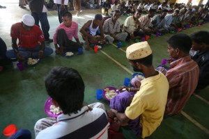 Bangladeshi migrants have their lunch at a temporary shelter for the migrants whose boats washed ashore on Sumatra island on Sunday, in Lhoksukon, Aceh province, Indonesia, Wednesday, May 13, 2015.