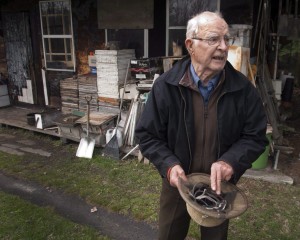 File-Vladimir Katriuk stands at his honeybee farm in Ormstown, Quebec. The second most wanted man on the Simon Wiesenthal Center's list of Nazi war criminals — charged earlier this month by Russia with genocide — has died at age 93, his lawyer said. Katriuk passed away last week after a long illness, Orest Rudzik said Thursday, May 28, 2015. 