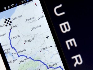 Nokia Maps is seen on a smartphone in front of a displayed logo of Uber in Zenica, Bosnia and Herzegovina, in this May 8, 2015  