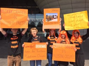 Activists protest outside the annual general meeting of Orange at the Palais des Congrès in Paris, 27 May.