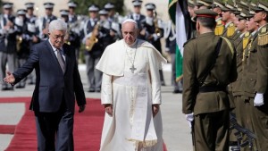 File-Pope Francis and Palestinian President Mahmoud Abbas review the honour guard on his arrival to Bethlehem.
