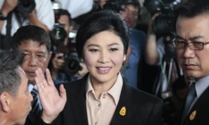 Yingluck Shinawatra greets well-wishers and supporters as she arrives at the supreme court on Tuesday. 19th may 2015.