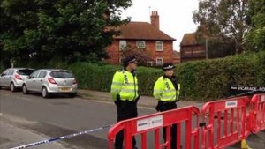A police cordon is in place at Vicarage Road, which has been closed to all but residents since the bodies were found on Saturday