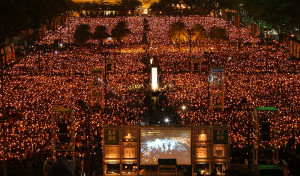 Tens of thousands of people attend a candlelight vigil at Victoria Park in Hong Kong Wednesday, June 4, 2014, to mark the 25th anniversary of the June 4th Chinese military crackdown on the pro-democracy movement in Beijing. 