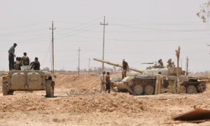 Iraqi tanks take up position during a military operation in western Samara, northern Iraq.
