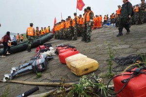 Rescuers gathered near the ship-sinking site Tuesday.