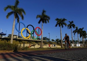 A man exercises next to the Olympic rings placed at the Madureira Park ahead the Rio 2016 Olympic Games, in Rio de Janeiro