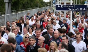 Fans arrive at Twickenham station for the first match of the Rugby World Cup. A man was hit by a train after falling on to the tracks after the match.