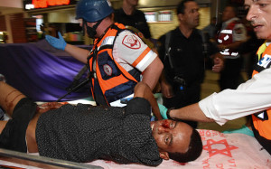 A wounded Eritrean is evacuated from the scene of an attack in Beersheba .