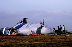 Police and investigators look at what remains of the flight deck of Pan Am 103 on a field in Lockerbie, Scotland, in December 22, 1988