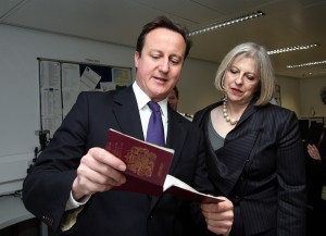 File-Prime Minister David Cameron and Home Secretary Teresa May visits UK Border Agency staff at Terminal 5 of Heathrow Airport, Middlesex. The PM and the Home Secretary was shown the difference between fake and real passports. . PRESS ASSOCIATION Photo. Picture date: Tuesday November 23, 2010