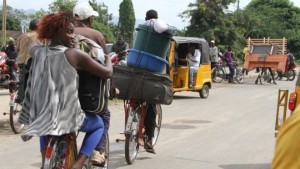 Bujumbura residents carry their belongings as they leave the city. 