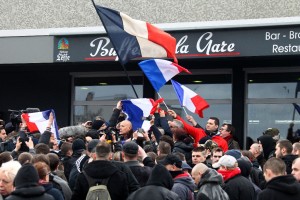 Extreme-right activists and supporters of PEGIDA (Patriotic Europeans against the Islamization of the West), demonstrate in front of the train station in Calais, northern France, Saturday, Feb. 6, 2016. Hundreds of extreme-right activists demonstrated Saturday to "save" Calais from homeless migrants inundating the French port city in hopes of crossing the English Channel to Britain