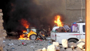 A car is engulfed by flames during clashes in the city of Ramadi, May 16, 2015. Islamic State militants drove security forces from a key military base in western Iraq on Sunday and Prime Minister Haider al-Abadi authorized the deployment of Shi'ite paramilitaries to wrest back control of the mainly Sunni province. Picture taken May 16, 2015.  REUTERS/Stringer