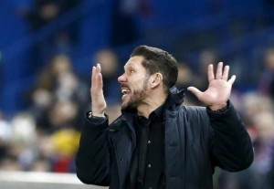 Atletico Madrid's coach Diego Simeone reacts during the match. 