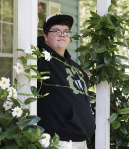 FILE - In this Aug. 25, 2015, file photo, Gavin Grimm poses on his front porch during an interview at his home in Gloucester, Va. 