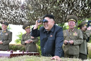 File-North Korean leader Kim Jong Un looks through a pair of binoculars during an inspection of the Hwa Islet Defence Detachment standing guard over a forward post off the east coast of the Korean peninsula.