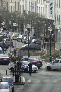 Police cordon off a road in Brussels Tuesday March 15, 2016, after police launched an anti-terror raid linked to last year's Paris attacks in a Brussels neighborhood and three police officers were slightly injured when shots were fired, officials said. 