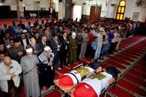 In this photo provided by the Ismailia Governor's office, citizens and dignitaries attend the funeral of Mohammed Taha Hassan Bakhit and Bassam Hindawi, two victims of a Saturday mortar attack on a checkpoint south of northern Sinai’s provincial capital of el-Arish, at a mosque in Ismailiya, Egypt, Egypt, Sunday, March 20, 2016. 