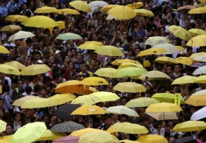 Pro-democracy protesters carrying yellow umbrellas, symbol of the Occupy Central civil disobedience movement, gather outside government headquarters in Hong Kong, China September 28, 2015.     
